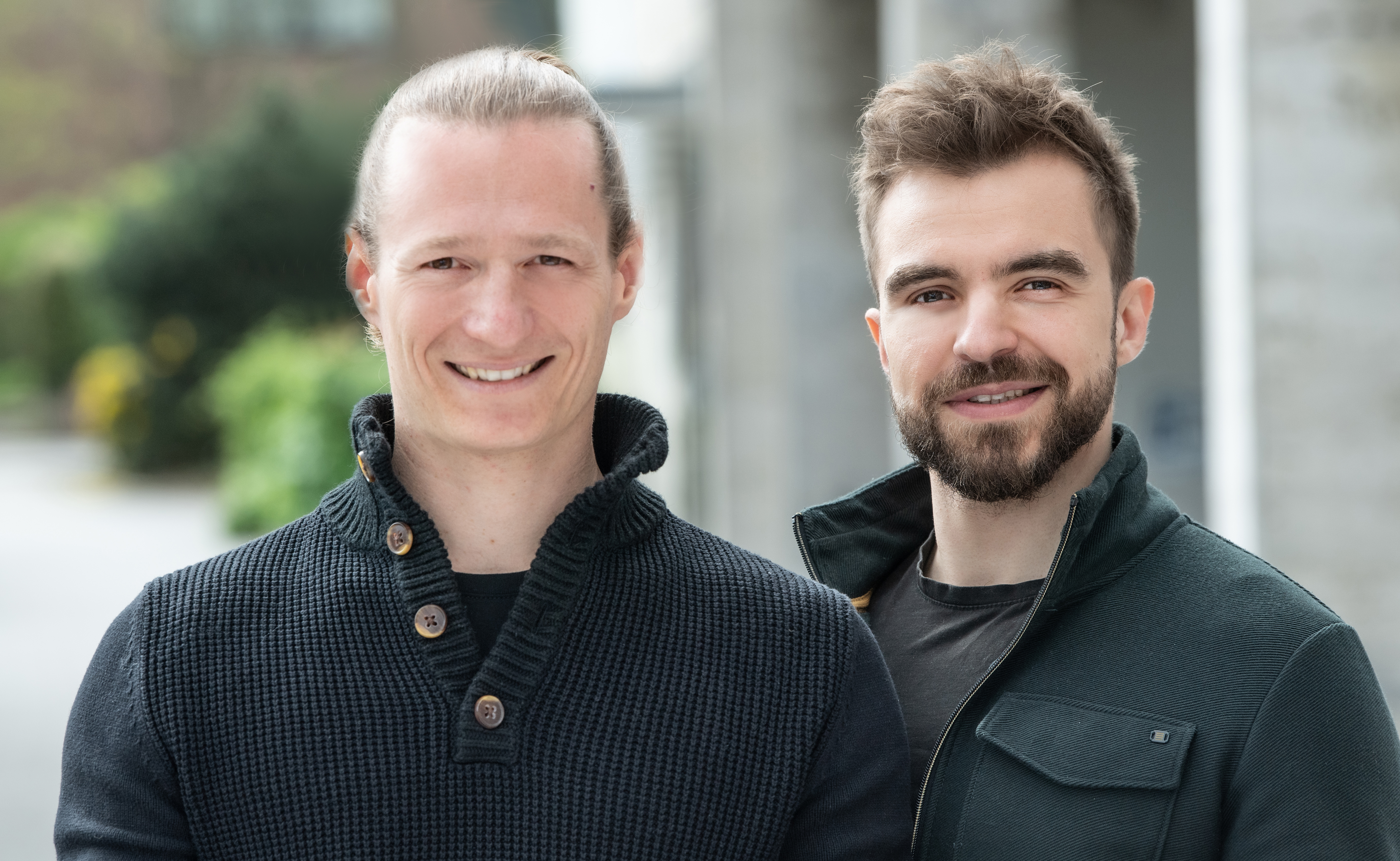 Franz Baur and Max Kayr, the founders of ZenoDev, smiling outdoors